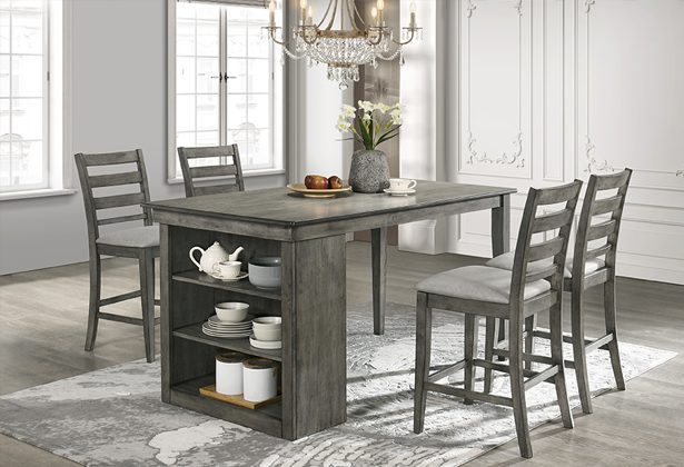 A dining room table with four chairs and a vase.