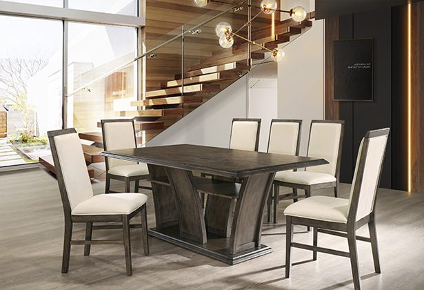 A dining room table with chairs around it