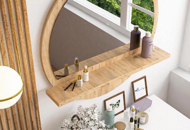 A mirror and shelf in the corner of a room.
