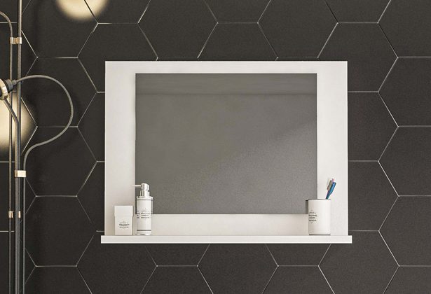 A bathroom mirror with a shelf above it