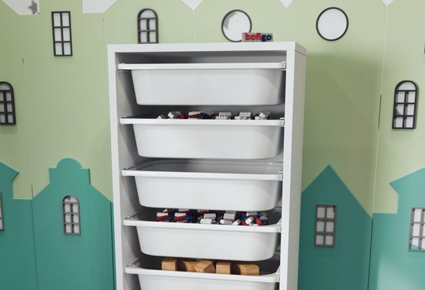 A white shelf with many bins on top of it.